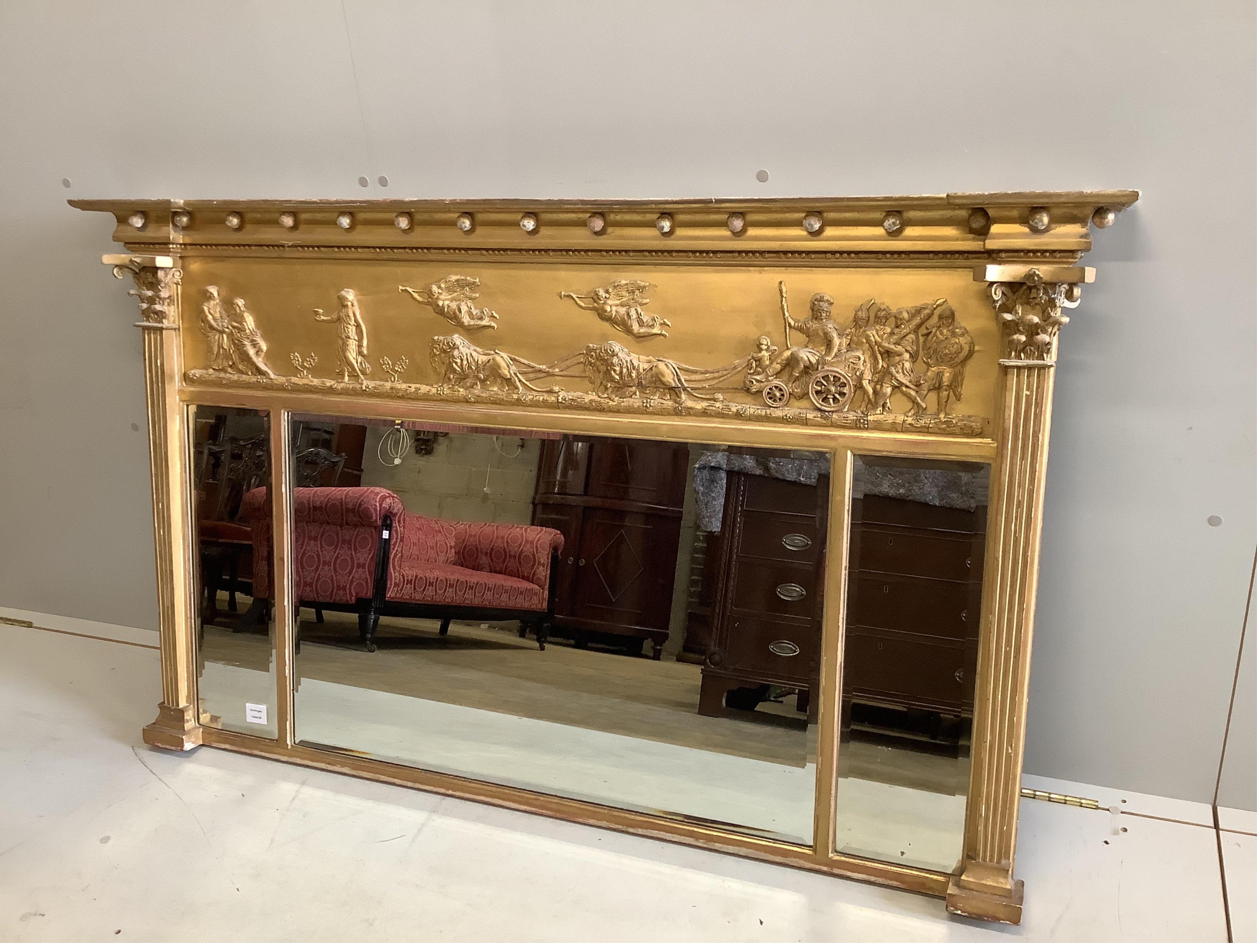 A Regency carved giltwood and composition triple plate overmantel mirror, width 151cm, height 89cm. Condition - fair